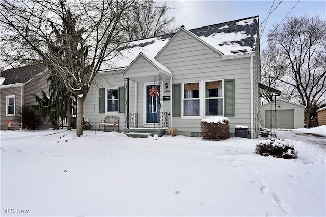 bungalow-style home with an outbuilding and a garage