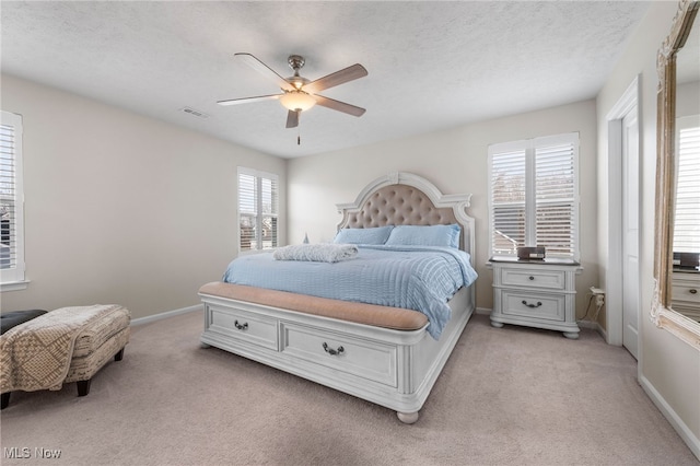 bedroom featuring light carpet, baseboards, and visible vents