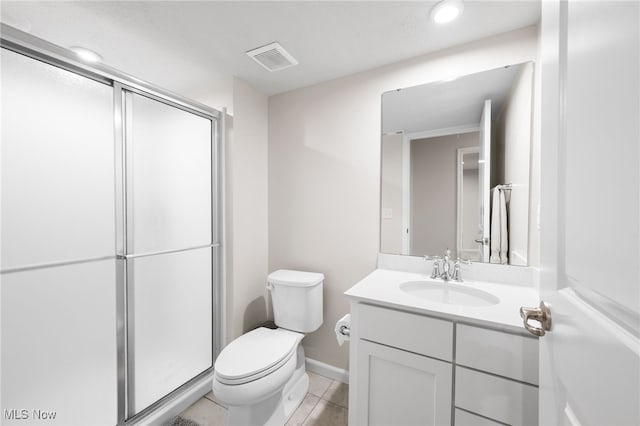 bathroom featuring visible vents, toilet, an enclosed shower, vanity, and tile patterned flooring