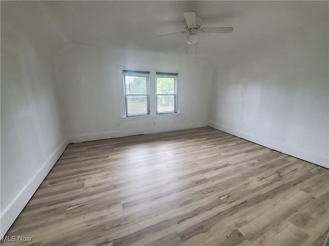 empty room with light wood-style floors and baseboards