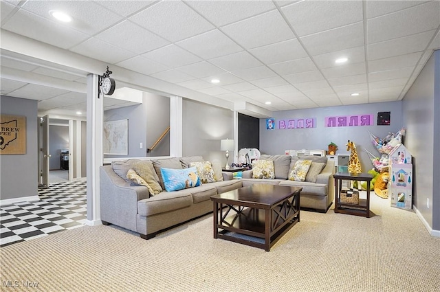 living room with baseboards, carpet flooring, a drop ceiling, and recessed lighting