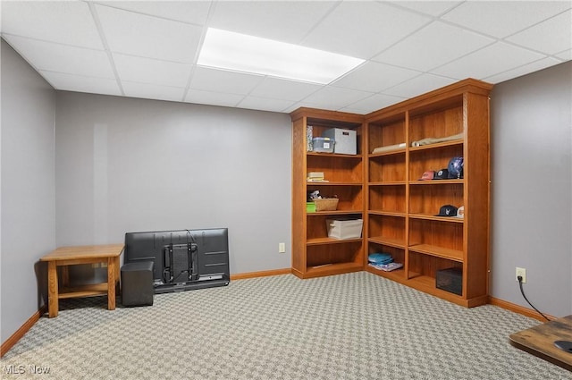 office with light carpet, a drop ceiling, and baseboards