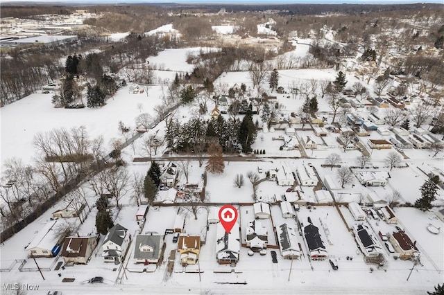 snowy aerial view with a residential view