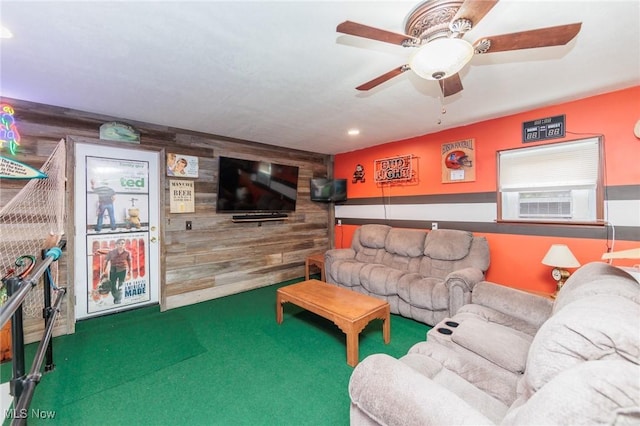 carpeted living room with recessed lighting, ceiling fan, and wood walls