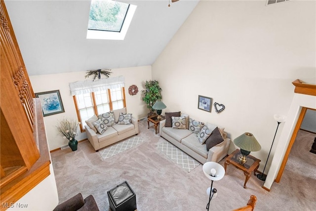 living room with a skylight, light colored carpet, high vaulted ceiling, baseboards, and stairs