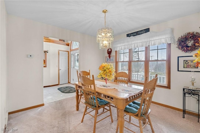 1925 N Lipkey Rd, North Jackson, OH 44451 - dining room with a chandelier, baseboards, and light carpet