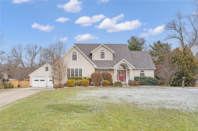 view of front of house featuring driveway, an attached garage, and a front yard