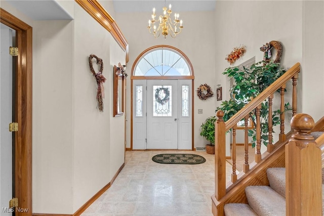 1925 N Lipkey Rd, North Jackson, OH 44451 - entrance foyer with a chandelier, stairway, a high ceiling, and baseboards