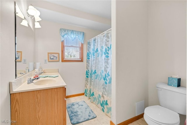 1925 N Lipkey Rd, North Jackson, OH 44451 - full bath featuring double vanity, toilet, tile patterned flooring, baseboards, and a shower with curtain
