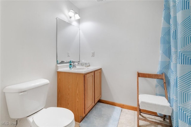 1925 N Lipkey Rd, North Jackson, OH 44451 - bathroom featuring toilet, vanity, tile patterned floors, and baseboards