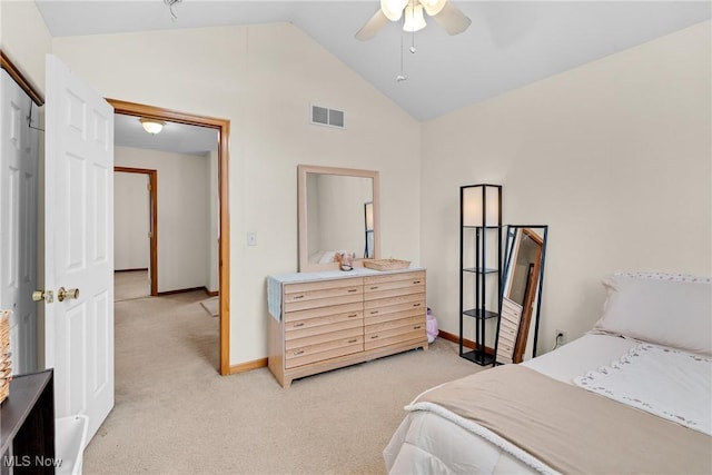 bedroom featuring light colored carpet, visible vents, lofted ceiling, and baseboards