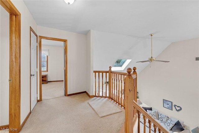 1925 N Lipkey Rd, North Jackson, OH 44451 - hall with light carpet, baseboards, lofted ceiling, a skylight, and an upstairs landing