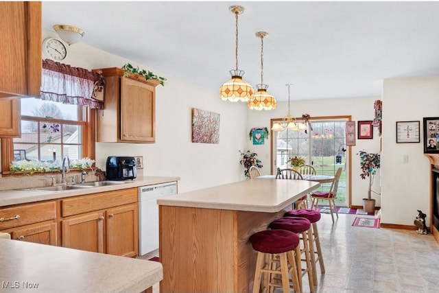 1925 N Lipkey Rd, North Jackson, OH 44451 - kitchen featuring dishwasher, a sink, healthy amount of natural light, and light countertops