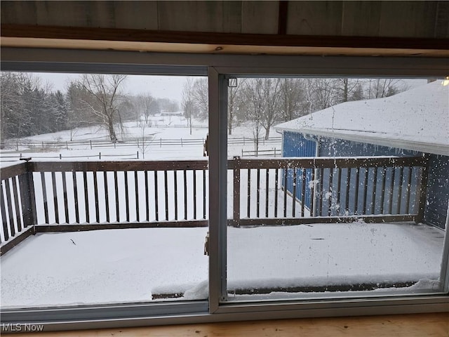 view of snow covered deck