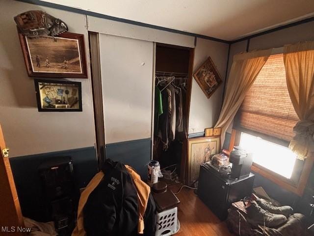 bedroom with a closet and wood finished floors