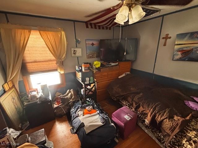 bedroom featuring wood finished floors