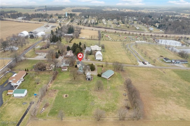 birds eye view of property featuring a rural view