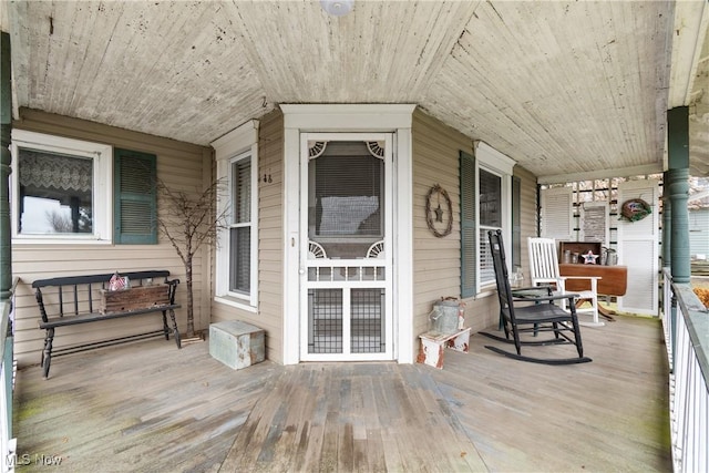 wooden terrace featuring a porch