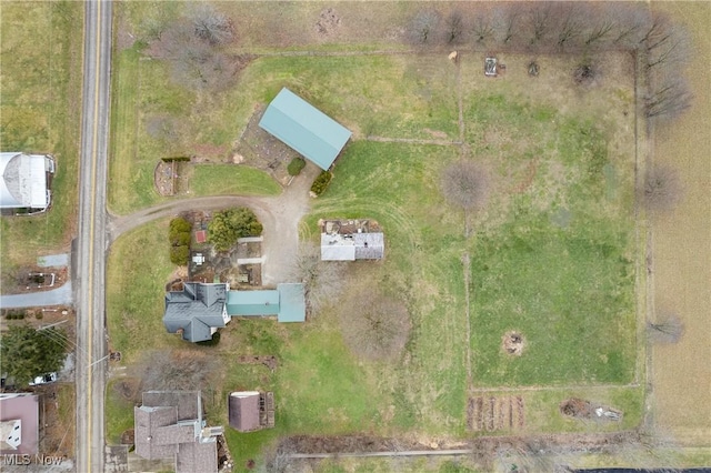 birds eye view of property with a rural view