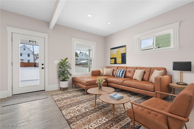 living room with light wood-type flooring, beam ceiling, baseboards, and recessed lighting