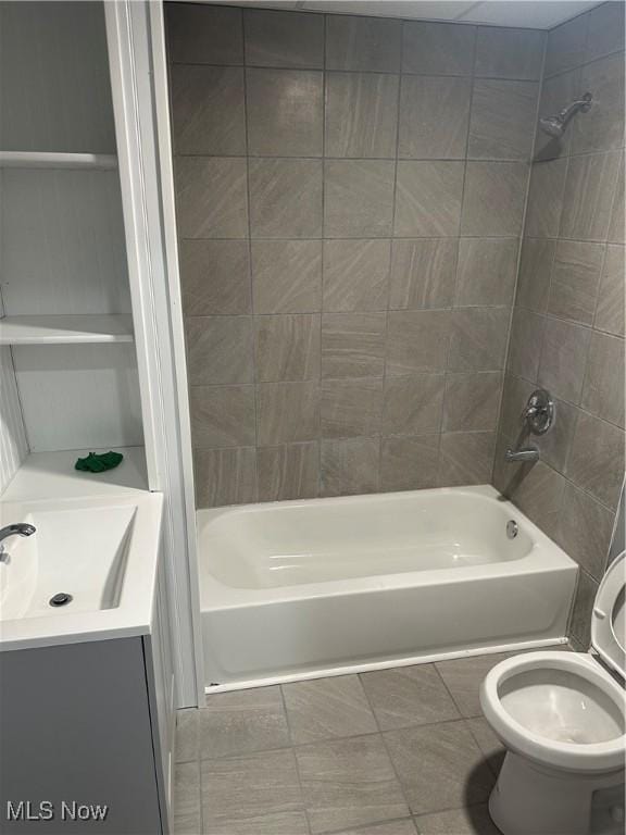 full bathroom with washtub / shower combination, vanity, and toilet