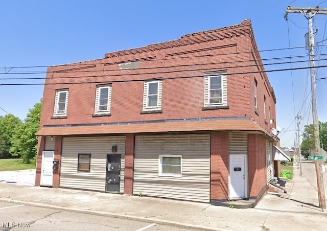 view of front of house featuring brick siding
