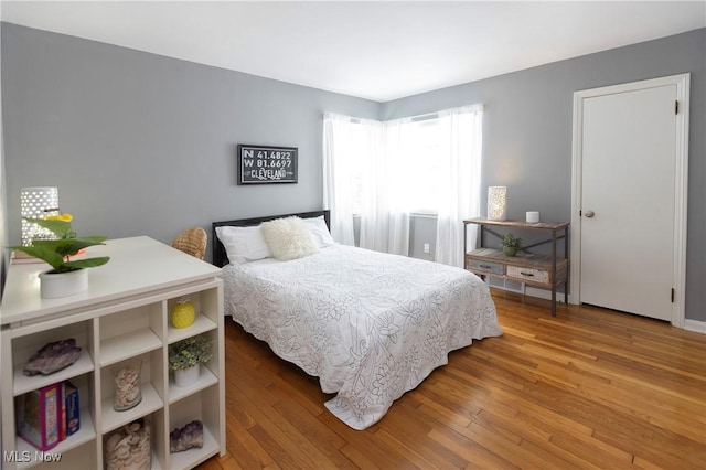 bedroom with wood finished floors