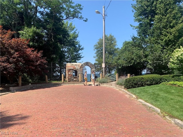 view of community with fence