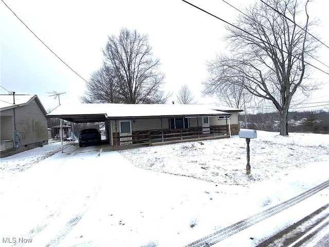 view of front of house with covered porch and a carport