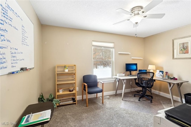 home office featuring carpet flooring, ceiling fan, a textured ceiling, and baseboards