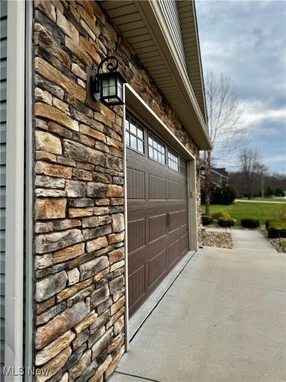 garage featuring driveway