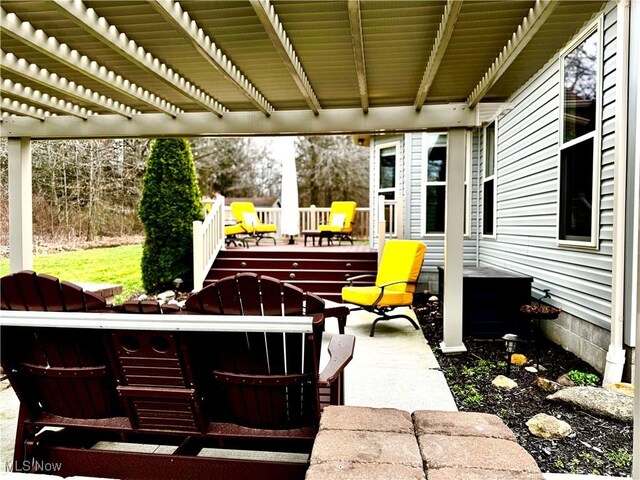 view of patio with a deck and a pergola