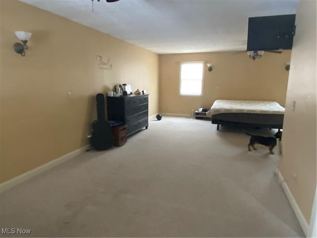 carpeted bedroom with baseboards