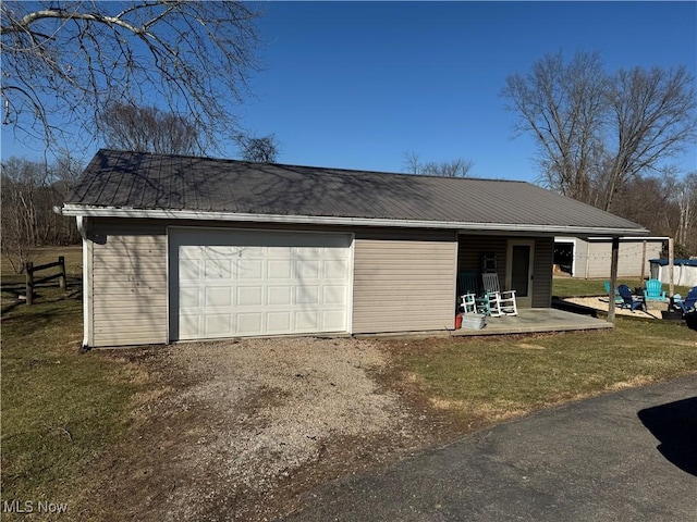 garage with dirt driveway