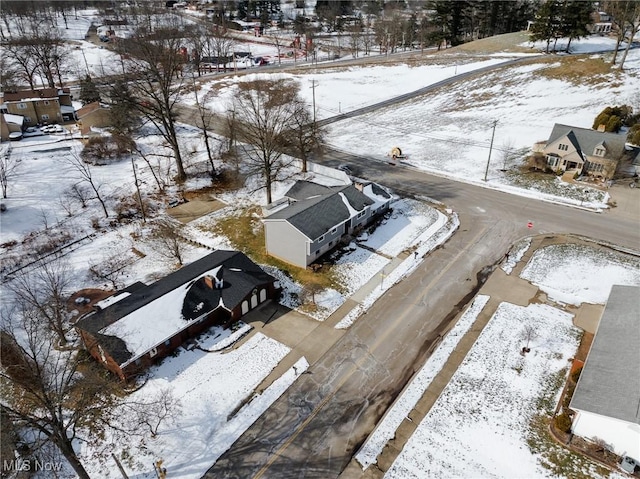 snowy aerial view featuring a residential view