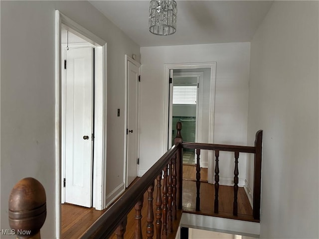 hallway featuring an upstairs landing