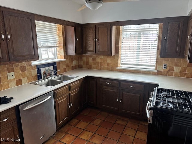 kitchen with range with gas cooktop, tasteful backsplash, light countertops, stainless steel dishwasher, and a sink