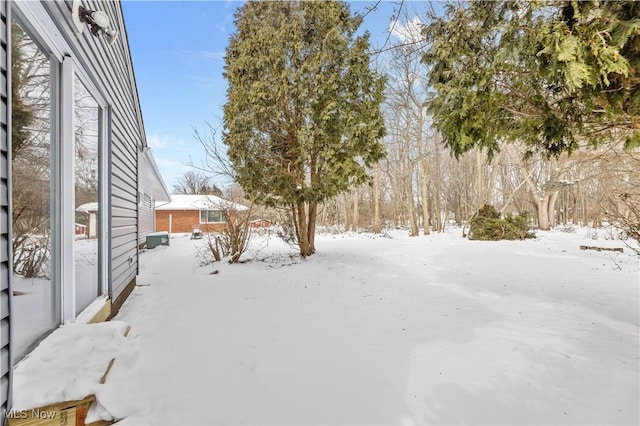 view of yard layered in snow