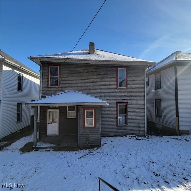 view of snow covered house