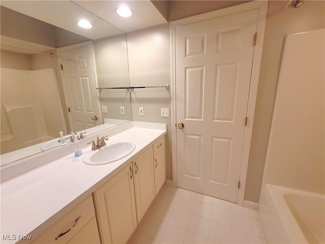 bathroom featuring tile patterned flooring, vanity, and recessed lighting