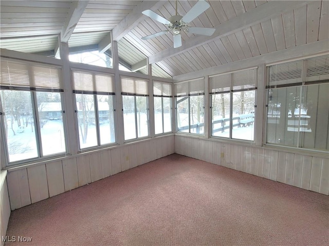 unfurnished sunroom with ceiling fan and lofted ceiling with beams