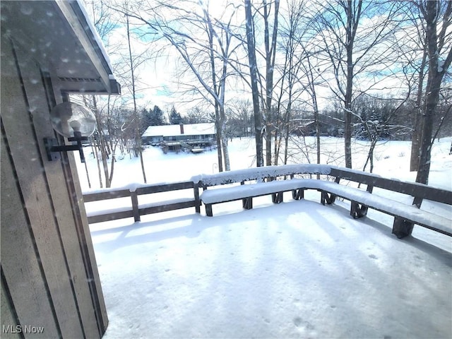 view of snow covered deck