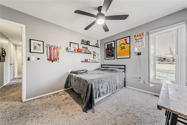 bedroom with carpet, baseboards, and ceiling fan