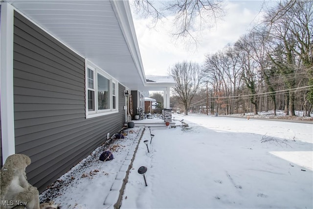 view of yard covered in snow