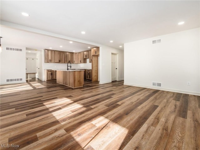 kitchen featuring visible vents and open floor plan