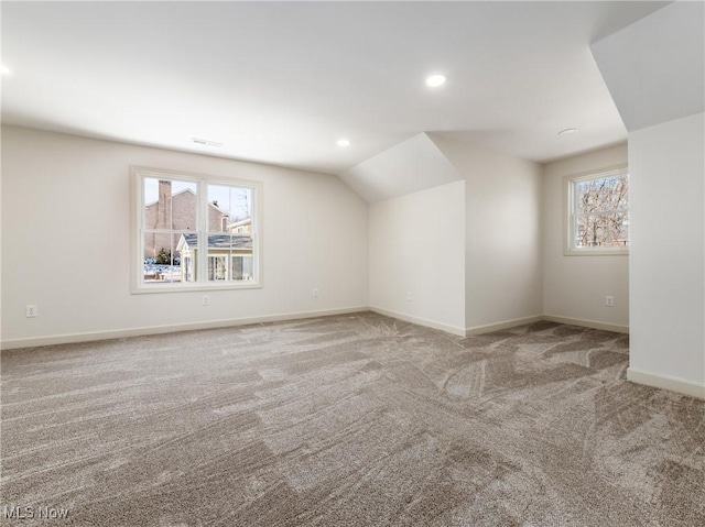 additional living space with carpet, lofted ceiling, baseboards, and recessed lighting