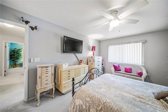 carpeted bedroom with a ceiling fan