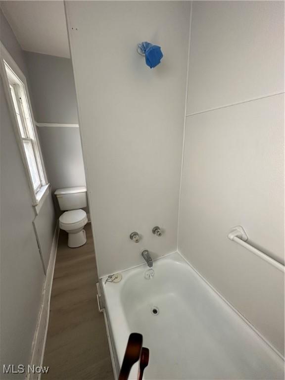 full bath with toilet and wood finished floors