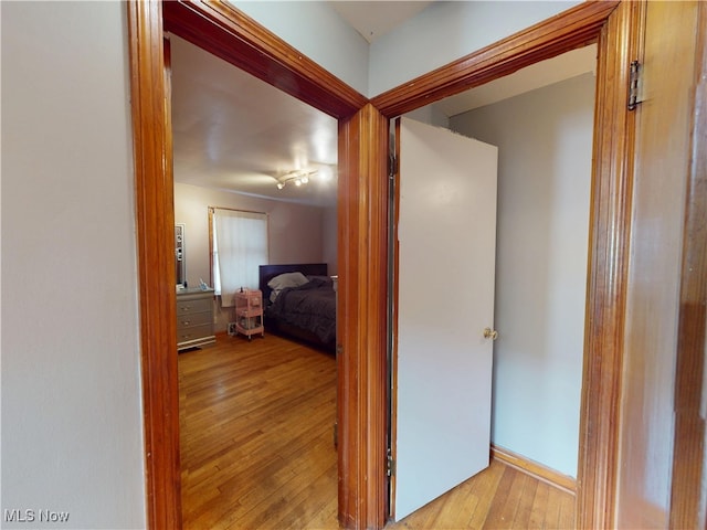 hallway with light wood-style floors