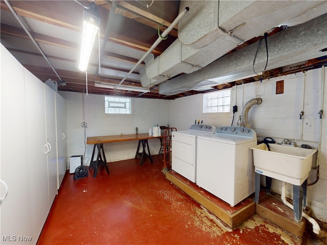 basement featuring a wealth of natural light and washer and dryer